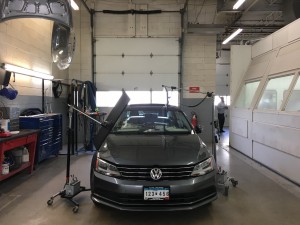 A car waiting in the Paintless Dent Repair booth